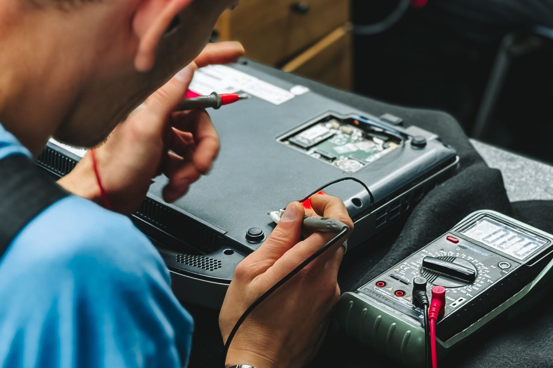 Appliance technician inspecting a machine component