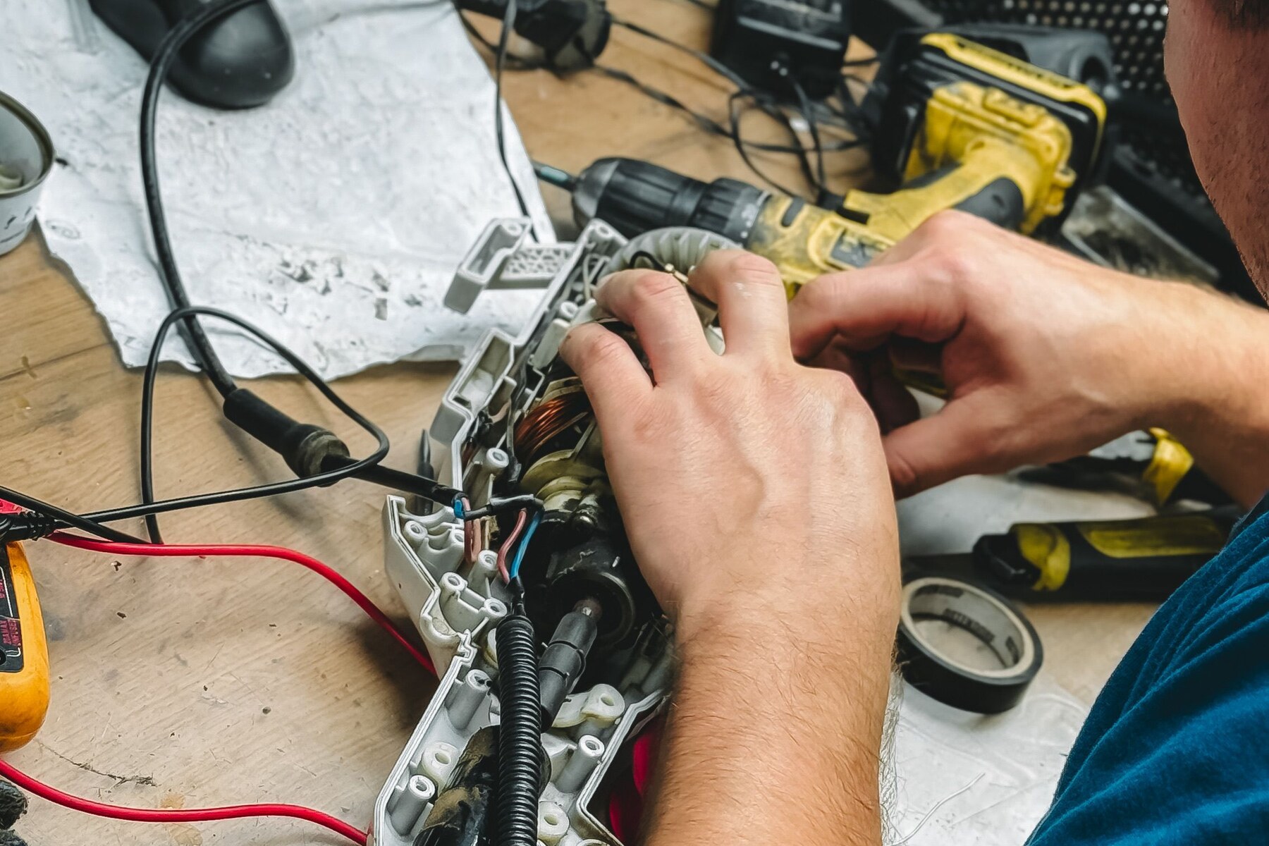 Real appliance components and diagnostic tools on a service bench